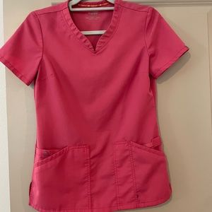 Two womens scrub sets.